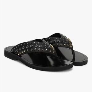 Jimmy Choo Black Flip Flops with Gold Star Accents